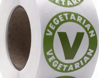 Puede incluir: Un rollo de etiquetas adhesivas blancas circulares con un borde circular verde y una letra V verde grande en el centro. La palabra VEGETARIAN está impresa en letras mayúsculas blancas a lo largo de la parte superior e inferior del borde.