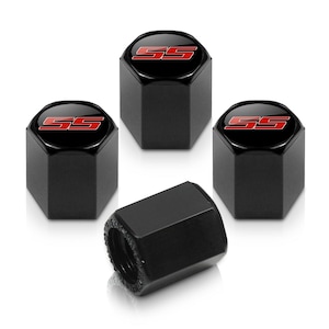 May include: Set of four black tire valve stem caps. Each cap has a glossy black finish with a red and white "SS" logo on the top. The caps are hexagonal in shape.