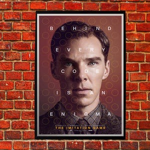 May include: A framed poster for "The Imitation Game" with Benedict Cumberbatch. The poster's design includes the text "Behind Every Code Is An Enigma" arranged around the actor's face. The poster is displayed against a red brick wall.