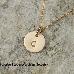 May include: A set of three ceramic mugs with a speckled, matte finish. The mugs are in shades of blue, green, and white. Each mug has a simple, modern design and a rounded handle. The mugs are likely for coffee or tea.