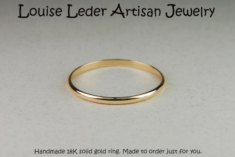 May include: A thin, polished 18K solid gold ring with a smooth, rounded band. The text Louise Leder Artisan Jewelry is at the top, and the text Handmade 18K solid gold ring. Made to order just for you. is at the bottom of the image.