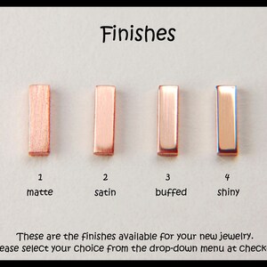 May include: Four rectangular copper metal bars arranged horizontally, each displaying a different surface texture labeled as 1 matte, 2 satin, 3 buffed, and 4 shiny. The text reads Finishes and These are the finishes available for your new jewelry.