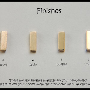 May include: Image showcasing four metal finish options: matte, satin, buffed, and shiny. Each finish is represented by a small, rectangular metal piece labeled with a number. The text "Finishes" is at the top.