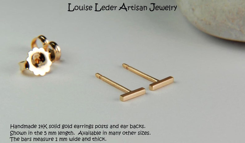 May include: A pair of 14K gold bar earrings with posts and ear backs. The earrings are shown in the 5 mm length. Handmade solid gold earrings. The bars measure 1 mm wide and thick.