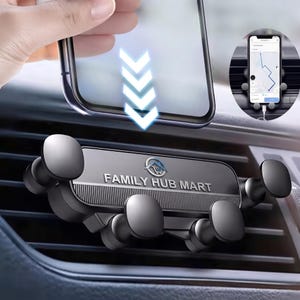 May include: A black car air vent phone mount featuring four rounded gripping arms and the text FAMILY HUB MART printed on the front. The device is designed to hold a smartphone securely in place, as shown by the inset image of a phone.