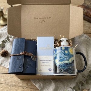 May include: A set of three ceramic mugs with a speckled, matte finish. The mugs are in shades of cream, light gray, and dark gray. Each mug has a simple, minimalist design, perfect for coffee or tea.