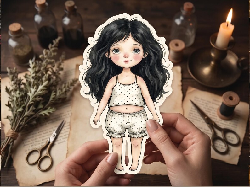 May include: A die-cut sticker of a cartoon character with long wavy black hair, large eyes, and rosy cheeks. The character wears a white two-piece outfit featuring a sleeveless top and ruffled shorts, both decorated with a small black polka dot pattern.
