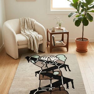 Abstract character wool rug in a cozy reading nook, designer statement carpet complementing Scandinavian-inspired interior decor.