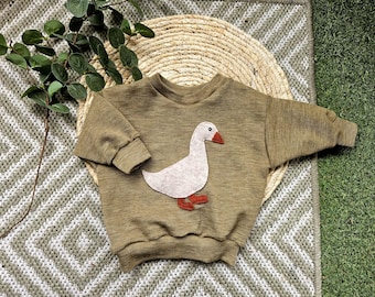 Oversized Merino Pullover handmade Baby Shirt in ocker beige aus Wolljersey mit Woll Gans. Pulli Frühling Unikat Wolle Merinowolle Gänslein