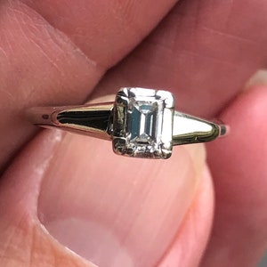 Classic Solitaire  style Emerald cut  20  point  VVS E diamond  in 14KT white gold classic wedding Engagement ring