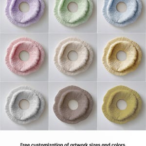 May include: Nine circular, textured wall art pieces in various pastel colors, including lavender, green, and pink. Each piece has a central hole and a layered, organic design. The image includes the text: "Free customization of artwork sizes and colors."