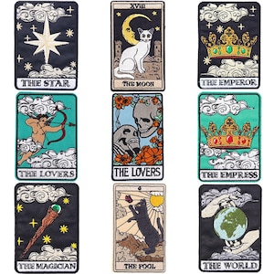 May include: A set of nine rectangular embroidered patches featuring tarot card designs. The patches depict various symbols including a star, a cat with a moon, crowns, a cupid, skulls, a magician's wand, a black cat, and the world globe.