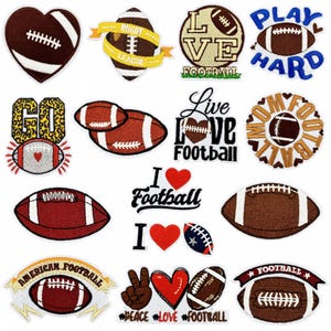 May include: A selection of embroidered football-themed patches. Designs include footballs, hearts, and text such as "Rugby League" and "Live Love Football." The patches are in brown, white, and blue, suitable for clothing or accessories.