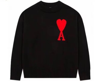 Pull en tricot noir avec motif coeur, col rond minimaliste doux