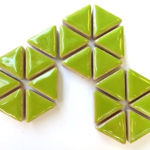 May include: Lime green triangular tiles arranged in a floral pattern. The tiles have a glossy finish and are set against a white background. Each tile measures approximately 1 inch on each side.