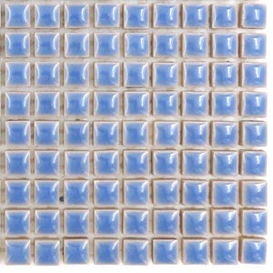 May include: A close-up view of a square mosaic tile sheet. The tiles are a light blue color with a glossy finish. Each tile is square and set in a grid pattern. The grout lines are a light beige color.