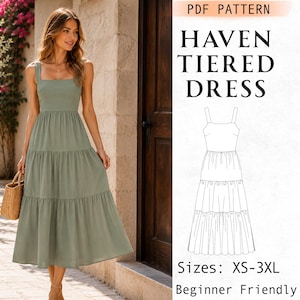 Peut inclure: Une robe à étages vert sauge avec une encolure carrée et de larges bretelles. L'image comprend un dessin technique de la robe avec le texte PDF PATTERN HAVEN TIERED DRESS, les tailles XS-3XL et la mention Beginner Friendly.