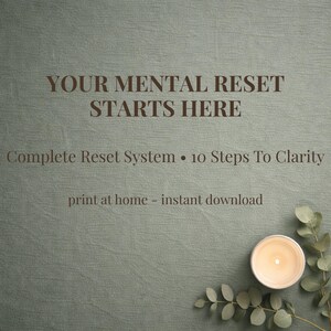 May include: A digital print with the text "YOUR MENTAL RESET STARTS HERE". The print also includes the text "Complete Reset System • 10 Steps To Clarity" and "print at home - instant download". A lit candle and greenery are in the bottom right corner.
