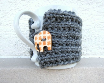 Scalda tazza lavorato a maglia, scalda tazza, caffè, grigio, grigio, elefante, autunno, bottone, passante, tè, cioccolata calda, coprimanica, maglia, uncinetto, arancione