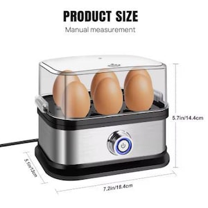 May include: An electric egg cooker with a clear lid, holding several brown eggs. The appliance is silver and black, with a power button. Dimensions are 7.2 inches long, 5.1 inches wide, and 5.7 inches tall.