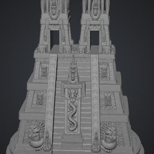 May include: A gray, three-dimensional model of a stepped pyramid temple featuring two tall towers at the summit, a central staircase with a carved serpent relief, and two large sculpted animal heads flanking the base on a circular platform.