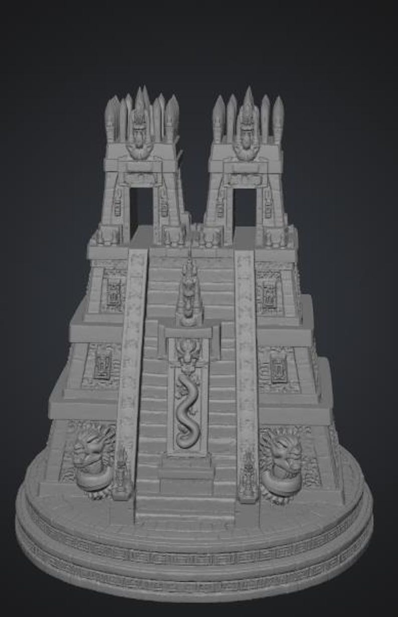 May include: A gray, three-dimensional model of a stepped pyramid temple featuring two tall towers at the summit, a central staircase with a carved serpent relief, and two large sculpted animal heads flanking the base on a circular platform.