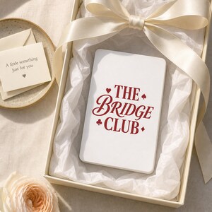 Embroidered 'Poker Cards' dad hat in a cream gift box with satin ribbon and tissue — lifestyle gift cap beautifully presented, perfect gift for card game lovers.