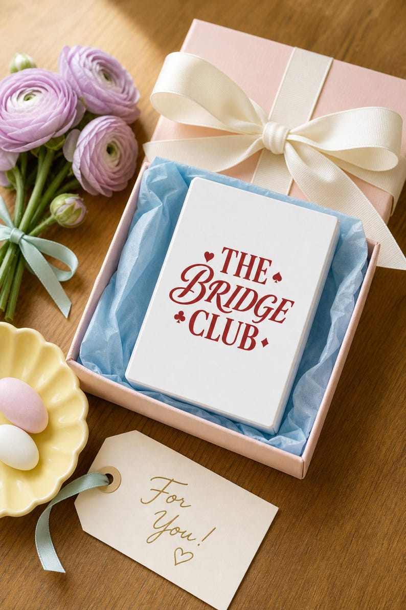 Poker Cards custom bridge playing card deck presented as a gift in a blush pink box with grosgrain bow — personalized card game gift for bridge lovers, preppy editorial gift photography.