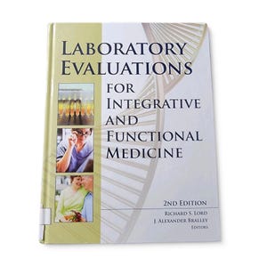 May include: A hardcover book titled "LABORATORY EVALUATIONS FOR INTEGRATIVE AND FUNCTIONAL MEDICINE, 2ND EDITION." The cover features images of laboratory samples and people. The book is a medical reference.