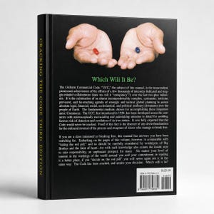 Op de afbeelding: Een boek getiteld "Cracking the Code Third Edition" met de tekst "Which Will It Be?" op de omslag. De omslag toont twee handen, elk met een pil, &eacute;&eacute;n rood en &eacute;&eacute;n blauw. De rug van het boek is zwart.