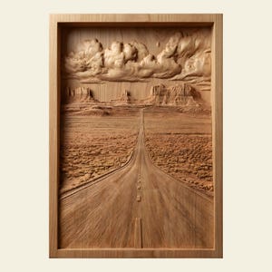 May include: A wooden relief carving depicting a desert landscape with a long road receding into the distance. The artwork features detailed carvings of clouds, mesas, and a textured road surface, all within a rectangular frame.