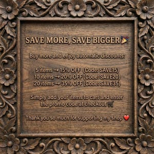 May include: A wooden sign with carved floral border. The sign reads "SAVE MORE, SAVE BIGGER" and lists discount codes for bulk purchases: SAVE15, SAVE20, and SAVE35. The sign is a warm brown color.