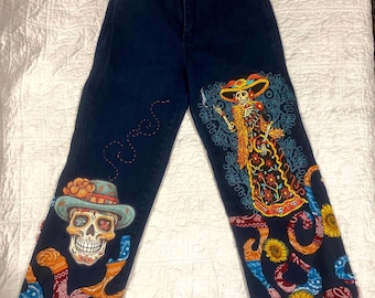 Upcycled Day of the Dead,  De Los Muertos jeans.  Hand embellished Skeleton Art pants.  One of a kind reworked vintage denim.