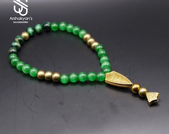 Rosario islámico Tasbih verde con detalles dorados, 33 cuentas.