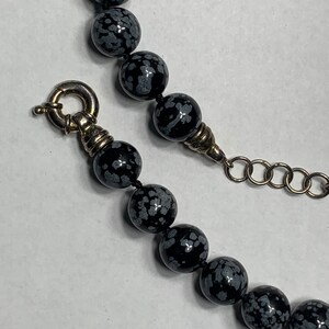 Snowflake obsidian beaded necklace with sterling silver class beads are 12 mm The necklace is 18 inches around the neck with a large Clasp image 4