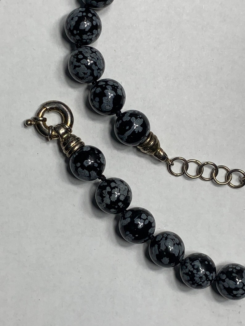 Snowflake obsidian beaded necklace with sterling silver class beads are 12 mm The necklace is 18 inches around the neck with a large Clasp image 4