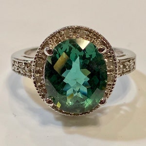 Delightful green amethyst And small white diamonds gemstone and sterling silver ring in a size 7 3/4
