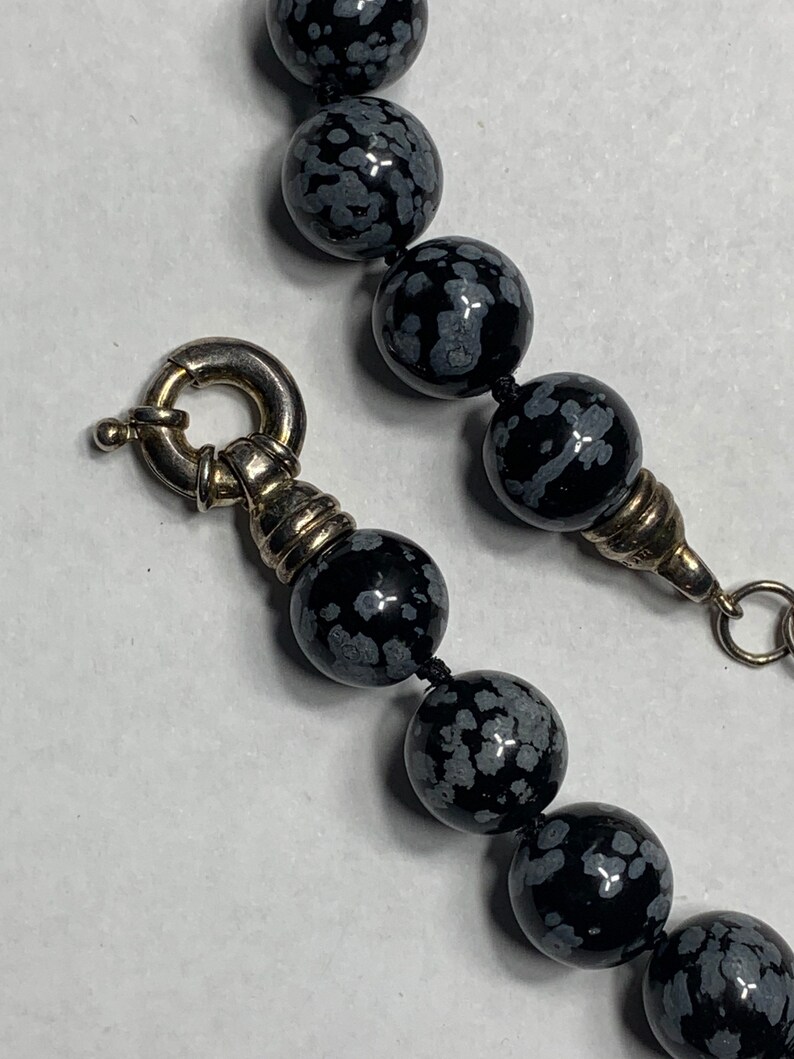 Snowflake obsidian beaded necklace with sterling silver class beads are 12 mm The necklace is 18 inches around the neck with a large Clasp image 2