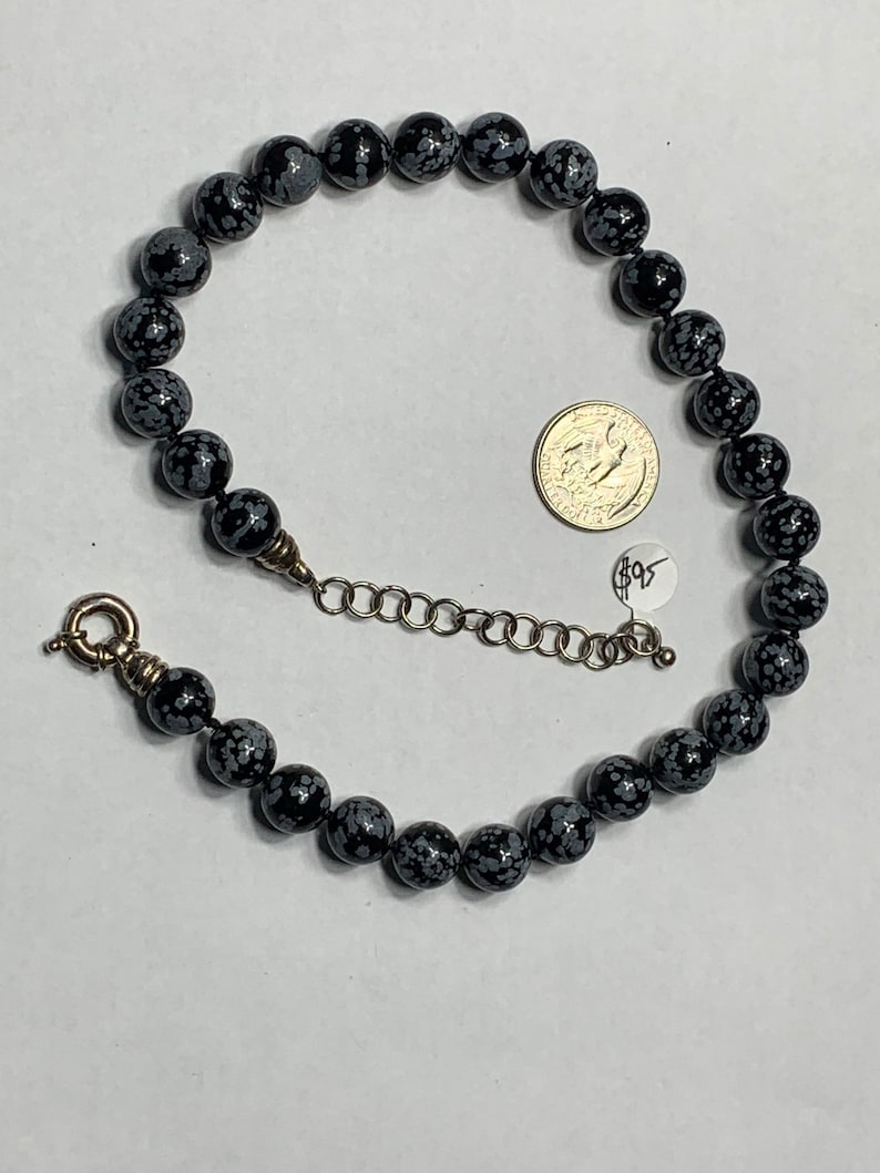 Snowflake obsidian beaded necklace with sterling silver class beads are 12 mm The necklace is 18 inches around the neck with a large Clasp image 1