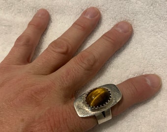 Handmade, sterling, silver, and tiger eye gemstone ring in a size 10 in a modern design, with a pierced crowned bezel