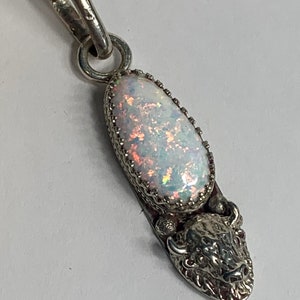 Handmade sterling silver white pink opal with blue green pendant completely made by me I shape the stone as well as constructed the pendant
