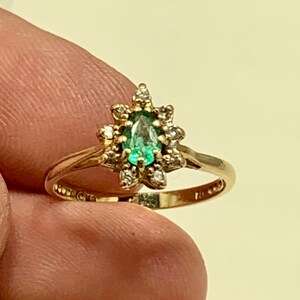 Vintage 14 karat Gold and green emerald with accent diamonds ring in a size 6