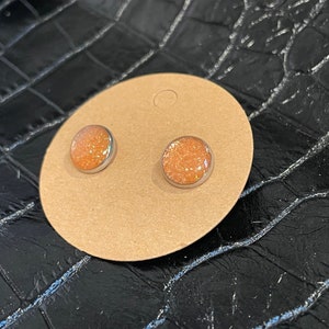 Peach glitter earring