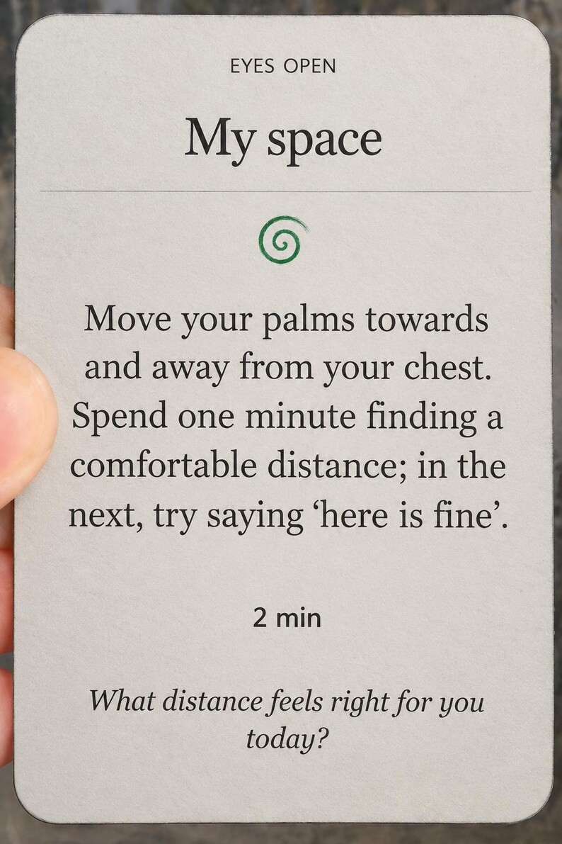 May include: A rectangular light gray card with rounded corners featuring the text EYES OPEN, My space, and instructions to move palms towards and away from the chest. It includes a green spiral icon, the text 2 min, and the question What distance feels right for you today?