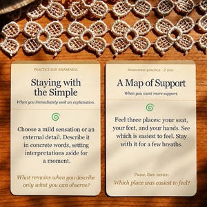May include: Two rectangular off-white cards with dark text and green spiral icons. The left card is titled Staying with the Simple, and the right card is titled A Map of Support. Both cards contain instructional text for awareness practice.