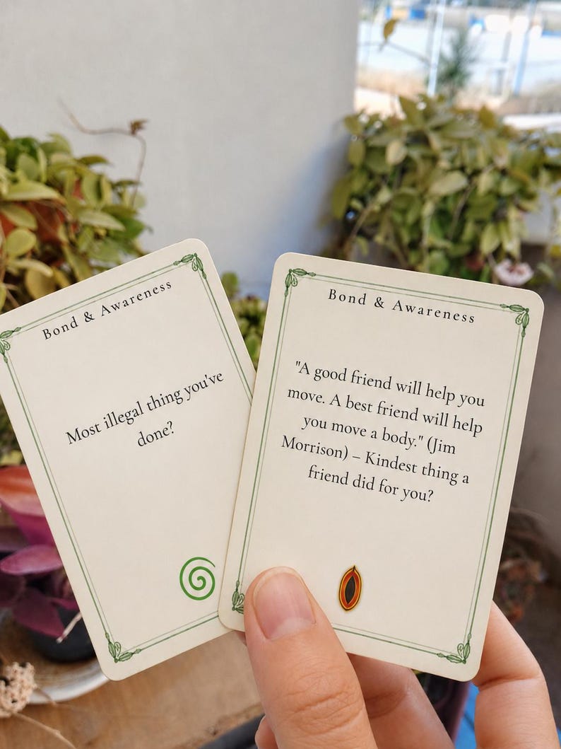 May include: Two rectangular off-white game cards with green decorative borders and the text Bond & Awareness. One card asks Most illegal thing you've done? with a green spiral icon. The other features a Jim Morrison quote and a small eye icon.