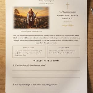 May include: A printed devotional page titled A Year With Christ Week 28 Contentment. It features an image of The Good Shepherd, a Philippians 4:11 quote, a reflection paragraph, a declaration box, an action step box, and two numbered reflection questions.