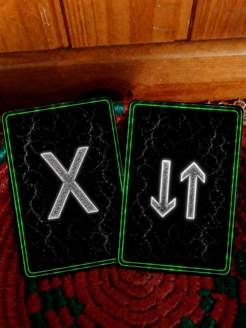 May include: Two rectangular cards with a black background featuring a cracked texture and a glowing green border. The left card displays a large white letter X. The right card displays a white downward-pointing arrow and a white upward-pointing arrow.
