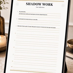 May include: A digital tablet displaying a Shadow Work reflection worksheet with black text on a white background. The page features the title Shadow Work, numbered lines for writing, and the text Bond & Awareness A SPACE FOR THOSE WHO DARE TO LOOK WITHIN.