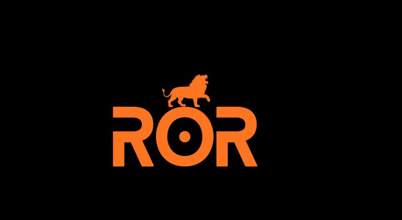 May include: Orange logo on a black background. The logo features the letters "ROR" in a bold, sans-serif font. Above the letters is an orange lion silhouette. The lion is standing with its front paws raised.